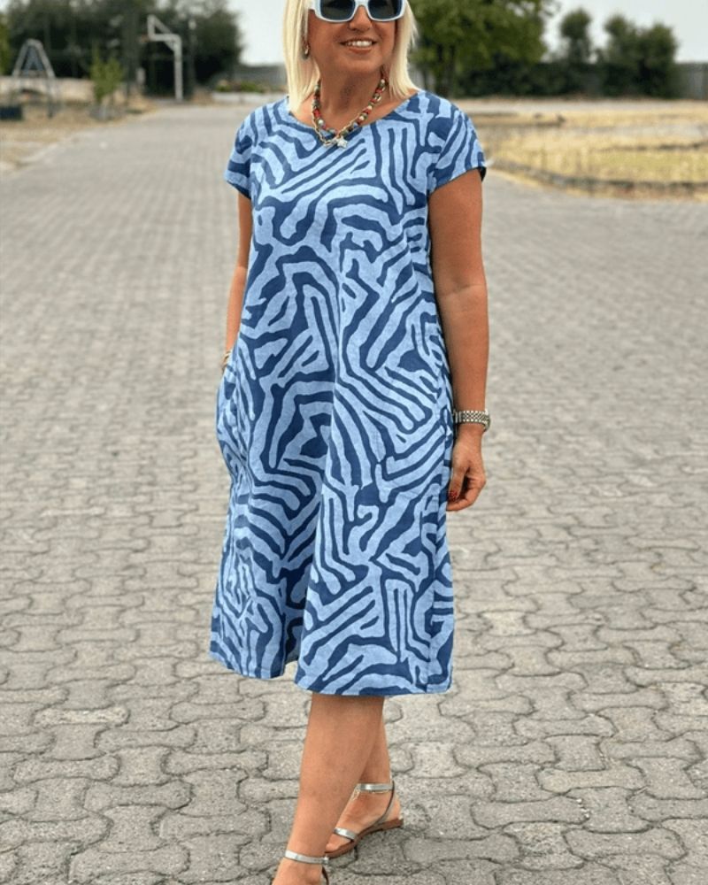 Nelia™ - Dress with a round neckline and a beautiful print