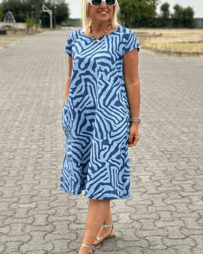 Nelia™ - Dress with a round neckline and a beautiful print
